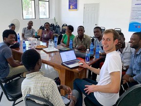 Samuel Mehenni was in Cap-Haitien, Haiti, leading a transit mapping project with the World Bank. He is shown here during his daily check-in with the project's local data collectors.