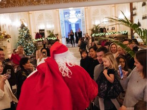 Santa dazzles the junior social set at the Ritz-Carlton Montreal's breakfast benefit event. Each guest also brought a donation for the Decarie Motors Drive for Toys.