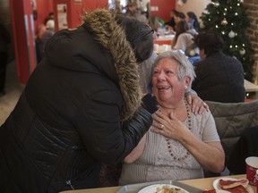 Friends comfort an emotional Erica Conca at a special Italian-themed Christmas Eve lunch at Chez Doris in Montreal on Saturday,  December 21, 2019.