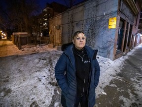 Jennifer Scodras, owner of Amélia's restaurant in Montreal's McGill Ghetto neighbourhood, stands in front of the two parking spots her delivery drivers had been allowed to use.  This summer the landlord informed her the spots are not part of her lease. Scodras got an injunction last week to halt the project.