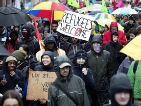 Anti-Bill 21 protesters take to the streets in the rain in Montreal on Oct. 27.