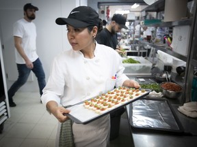 Isabele Palacios finishes up hors d’oeuvres during lunch preparations at Dansereau Traiteur’s headquarters. “Each banquet is not just for the client — it’s for the guests who could be future clients,” says Dansereau events director Odette Levesque.