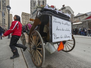 Driver Nathalie Matte steps down from her caleche in Old Montreal on Sunday, Dec. 29, 2019.