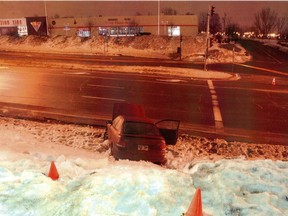 A victim's car at the scene of a double murder in 2010, in the parking lot of a McDonald's in N.D.G. Brian McGuire pleaded guilty to taking part in a conspiracy that led to the deaths of Kirk (Cowboy) Murray and Antonio Onesi.