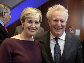 Former premier Jean Charest and his wife, Michèle Dionne, at a book launch in 2018.