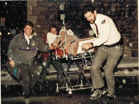 Wounded Polytechnique student Nathalie Provost is hustled into Royal Victoria Hospital on a stretcher on Dec. 6, 1989. She had been shot, but survived.