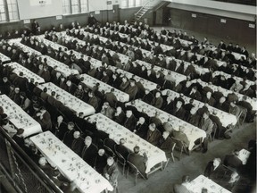 Hundreds of homeless and unattached men wait for the Salvation Army's Christmas dinner to be served Dec. 18, 1952 at the Victoria Rifles of Canada Armory on Cathcart Street in Montreal.