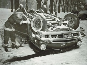 The original caption on photo, dated Dec. 24, 1955: "Santa Claus paused to look at this auto which skidded out of control and crashed into a traffic island at Park and Duluth avenues this morning. The occupants were taken to the Royal Victoria Hospital."