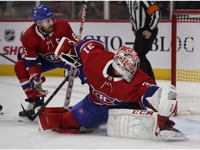 Canadiens goaltender Carey Price watches as a shot hits the pipes against the Detroit Red Wings in Montreal on Saturday, Dec. 14, 2019.