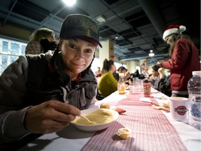 Caroline Richardson enjoys a warm soup during the annual Chez Doris Christmas lunch in Montreal, on Tuesday, December 17, 2019.