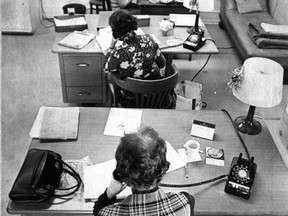 Tel-Aide volunteers take calls. This photo was published on Dec. 27, 1972.