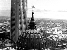 This photo, published in the Montreal Gazette on Dec. 30, 1965, shows the dome of Mary Queen of the World cathedral in the foreground and the Chateau Champlain hotel under construction in the background. Windsor Station is at right.