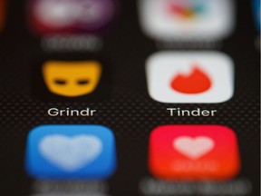 LONDON, ENGLAND - NOVEMBER 24:  The "Grindr" and "Tinder" app logos are seen on a mobile phone screen on November 24, 2016 in London, England.  Following a number of deaths linked to the use of anonymous online dating apps, the police have warned users to be aware of the risks involved, following the growth in the scale of violence and sexual assaults linked to their use.  (Photo by Leon Neal/Getty Images) ORG XMIT: 684286573