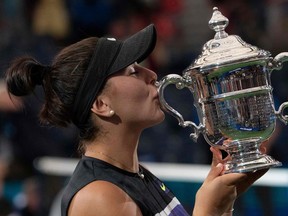 Bianca Andreescu poses with U.S. Open trophy after defeating Serena Williams at the Billie Jean King National Tennis Center in New York on Sept. 7, 2019.