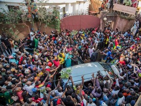 In this file photo taken on Oct. 5, 2019, Cameroonian opposition leader Maurice Kamto is greeted and acclaimed by hundreds of supporters in Yaounde  after his release from prison. The United States on Nov. 19, 2019, urged Cameroon to devolve power in its troubled anglophone region, saying the government's military response was only strengthening separatists. The warning came weeks after the United States ended certain preferential trade benefits for Cameroon, citing human-rights violations including arbitrary killings. Tibor Nagy, the top U.S. diplomat for Africa, said he believed advisers to Cameroon's veteran resident, Paul Biya, were telling him "you can win this militarily." "The truth is, it's not going to be won militarily," Nagy told a House Foreign Affairs subcommittee.