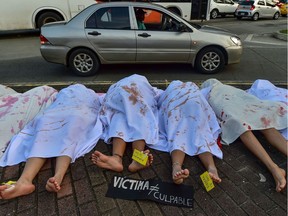Women perform in memory of women killed in Panama, during the International Day for the Elimination of Violence against Women, in Panama City, on November 25, 2019. (Photo by Luis ACOSTA / AFP)