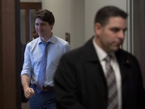 Prime Minister Justin Trudeau smiles as he leaves a caucus meeting in West block, Wednesday December 11, 2019 in Ottawa.