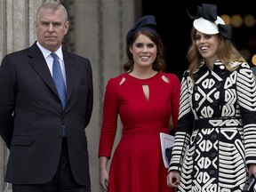 In this file photo taken on June 10, 2016, Prince Andrew, left, and his daughters Princess Eugenie of York (second left) and Princess Beatrice of York leave after attending a national service of thanksgiving for the 90th birthday of Queen Elizabeth II at St Paul's Cathedral in London.