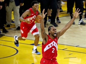Raptors forward Kawhi Leonard (2) and guard Kyle Lowry celebrate winning the NBA Championship in June. Surprisingly, a Toronto team's drive for the NBA title captured the imagination of Quebecers in 2019.