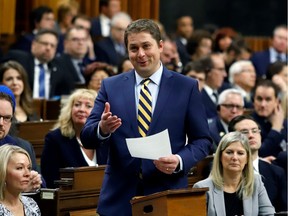 Conservative Party leader and Leader of the Official Opposition Andrew Scheer welcomes Members of Parliament to the House of Commons as parliament prepares to resume for the first time since the election in Ottawa, Ontario, Canada December 5, 2019. REUTERS/Patrick Doyle