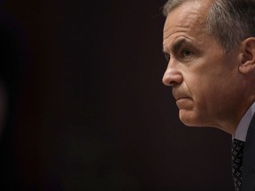 Mark Carney, the governor of the Bank of England, listens to a journalist's question during a Financial Stability Report press conference at the Bank of England in London on July 11, 2019.