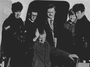 James Cross waves goodbye to Canada as he boards a plane Dec. 5, 1970 in Montreal, for London, England. He had been held in captivity for two months by the FLQ.