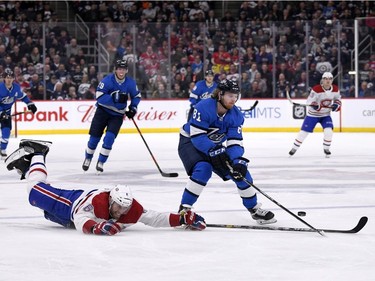 Winnipeg Jets' Kyle Connor (81) gets past Montreal Canadiens' Shea Weber (6) on a breakaway during second period NHL action in Winnipeg on Monday Dec. 23, 2019.