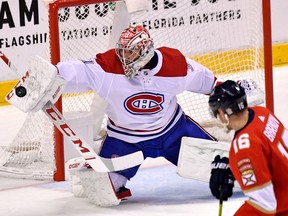 Canadiens goaltender Carey Price turns away a shot from Panthers centre Aleksander Barkov during third-period action in Sunrise, Fla., Sunday night.