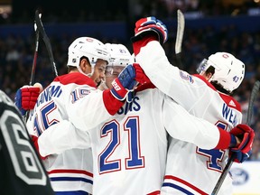 The Montreal Canadiens' Jesperi Kotkaniemi (15) is congratulated by teammates as he scores a goal against the Tampa Bay Lightning during the first period on Saturday, Dec. 28, 2019.