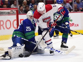 Canucks goaltender Jacob Markstrom makes save on the Canadiens' Nick Suzuki during the second period of NHL game at Rogers Arena in Vancouver on Dec. 27, 2019.