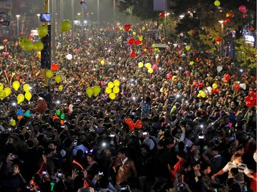 People release balloons as they celebrate the New Year's countdown event in a road in Ahmedabad, India, January 1, 2020. REUTERS/Amit Dave