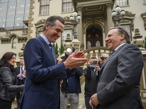 California Gov. Gavin Newsom has a debate with Francois Legault, Premier of Quebec, about wine outside the Stanford Mansion on Wednesday, Dec.11, 2019, in Sacramento, Calif. (Renée C. Byer/The Sacramento Bee via AP, Pool) ORG XMIT: CASAB105