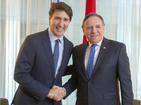 Prime Minister Justin Trudeau shakes hands with Quebec Premier François Legault before their meeting in Montreal, Friday, Dec. 13, 2019.