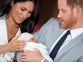 Britain's Prince Harry and Meghan, Duchess of Sussex hold their baby son, Archie.