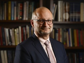 Minister of Justice and Attorney General of Canada David Lametti poses for a portrait on Parliament Hill in Ottawa on Wednesday, Dec. 11, 2019. Lametti says the director of public prosecutions should be the one to decide whether a company should have access to a remediation agreement to avoid being pursued for economic crimes -- most of the time.