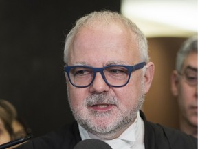 Crown prosecutor Richard Roy speaks to reporters at the Montreal courthouse.