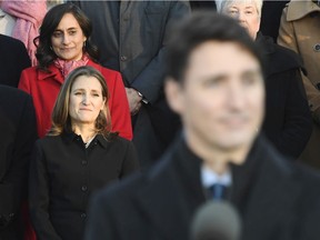 Justin Trudeau may be the 'brand,' but Chrystia Freeland (in black to his immediate left) now has a mandate as minister of everything.