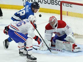 Winnipeg Jets forward Jack Roslovic watches as his chance on Montreal Canadiens goaltender Carey Price is spoiled as Jeff Petry defends in Winnipeg on Dec. 23, 2019.