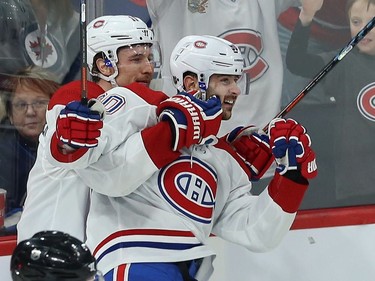 Montreal Canadiens forward Tomas Tatar (right) celebrates his goal against the Winnipeg Jets in Winnipeg with Brendan Gallagher on Mon., Dec. 23, 2019.
