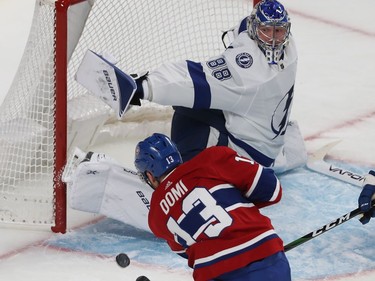 Montreal Canadiens' Max Domi (13) shoots at Tampa Bay Lightning goaltender Andrei Vasilevskiy during first period NHL action in Montreal on Thursday Jan. 2, 2020.