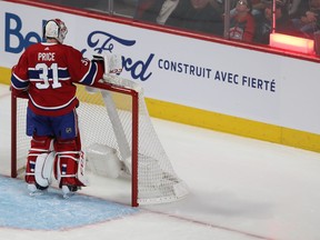 Canadiens goaltender Carey Price reaches for the water bottle after a goal from Tampa Bay Lightning's Nikita Kucherov in Montreal on Jan. 2, 2020.