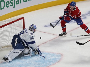 Montreal Canadiens' Nick Cousins (21) grimaces as he shoots puck at Tampa Bay Lightning's Andrei Vasilevskiy, during first period NHL action in Montreal on Jan. 2, 2020.