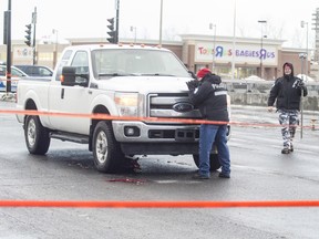 Montreal police examine a pickup truck that fatally struck a pedestrian in January 2017.
