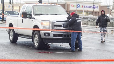 Montreal police examine a pickup truck that fatally struck a pedestrian in January 2017.
