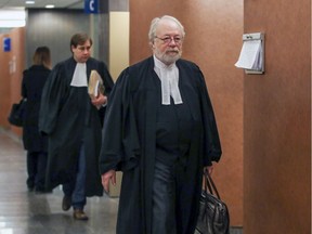 Gilbert Rozon's lawyer Pierre Poupart leads prosecutor Bruno Ménard through the halls of the Palais de Justice in Montreal Tuesday January 7, 2020 following a hearing to set a date for Rozon's trial on charges of indecent assualt and rape.