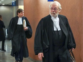 Gilbert Rozon's lawyer Pierre Poupart leads prosecutor Bruno Ménard through the halls of the Palais de Justice in Montreal Jan. 7, 2020.