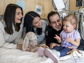 Two-year-old Lena Andrianakos with aunt Sophia Kadas, left, mother Christina Kadas and father Nick Andrianakos at the Montreal Children's Hospital in Montreal Thursday January 9, 2020, where Lena is being treated for leukemia. Her family learned last week that Lena's leukemia is in remission. Aunt Sophia, who turned 30 this month, asked people to make donations to the Montreal Children's Hospital Foundation through a GoFundMe campaign she set up to mark her 30th birthday instead of buying her birthday gifts.