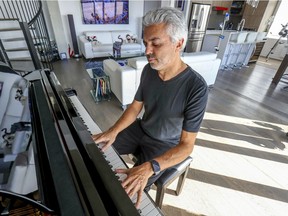 Gad Elmoznino plays the piano in the Lower Westmount home he shares with wife, Roselyne Perrault.