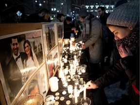 Candles are lit during a Montreal vigil Thursday in honour of victims of the plane crash in Iran.