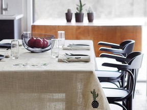 The new kitchen makes room for the family table and is a great way to create a meeting hub in the home. Embroidered Cactus Tablecloth, Simons Maison.
